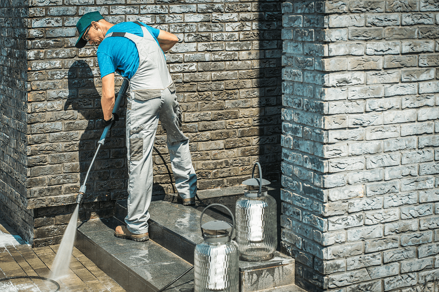 pavement-cleaning-urban-gardeners-south-east-london Man from Urban Gardeners cleaning pavement with pressure washing tool